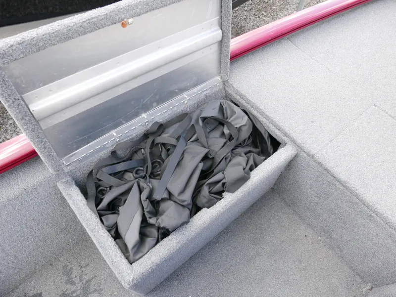Slide: The Image of Open storage compartment in 2022 Tracker Pro 170 boat. - 11