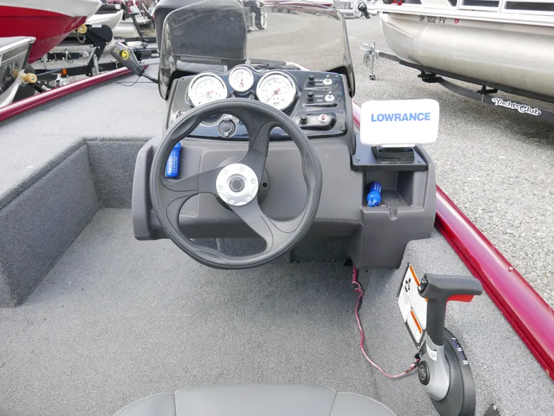 Slide: The Image of 2022 Tracker Pro 170 boat dashboard with steering wheel and Lowrance fish finder. - 15