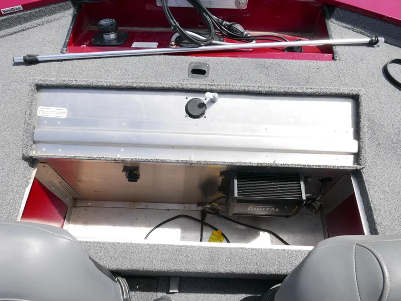 Slide: The Image of 2022 Tracker Pro 170 boat storage compartment with digital charger. - 16
