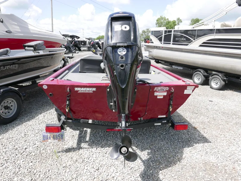 Slide: The Image of 2022 Tracker Pro 170 boat with 50 HP motor, rear view in a boatyard. - 3
