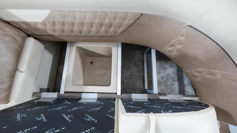 Slide: The Image of 2021 Crest Classic Platinum 220 SLSC interior seating and storage area. - 11