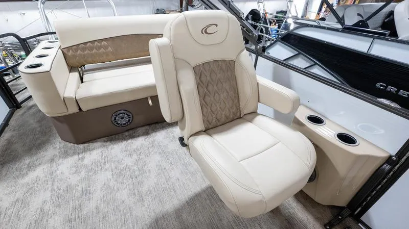 Slide: The Image of 2021 Crest Classic Platinum 220 SLSC boat interior with luxurious seating. - 14