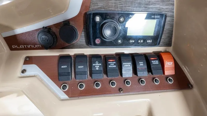 Slide: The Image of Control panel of a 2021 Crest Classic Platinum 220 SLSC boat. - 18