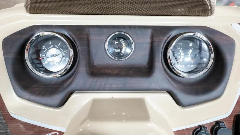 Slide: The Image of Dashboard of 2021 Crest Classic Platinum 220 SLSC boat with RPM, trim, and volt/fuel gauges. - 19