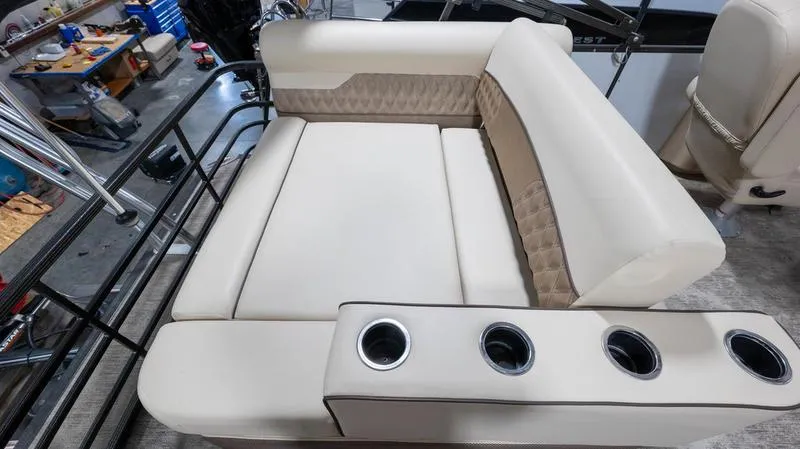 Slide: The Image of 2021 Crest Classic Platinum 220 SLSC boat interior seating with cup holders. - 25