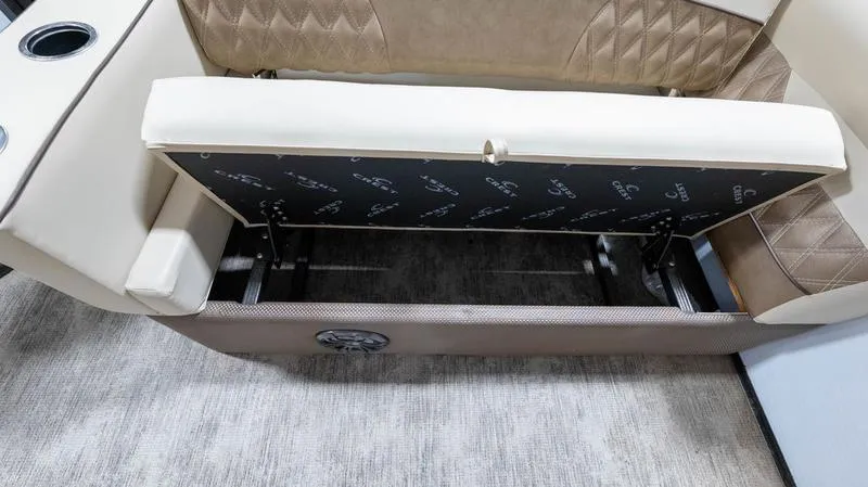 Slide: The Image of 2021 Crest Classic Platinum 220 SLSC boat seat storage compartment. - 26