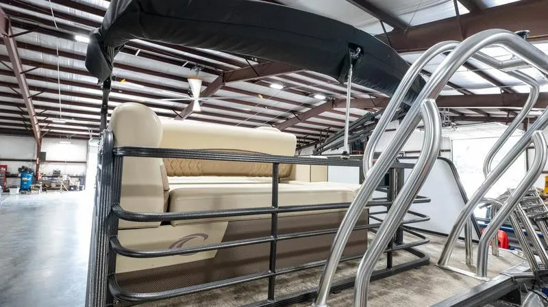 Slide: The Image of 2021 Crest Classic Platinum 220 SLSC pontoon boat in a warehouse. - 28