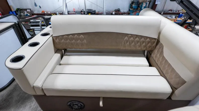 Slide: The Image of 2021 Crest Classic Platinum 220 SLSC boat interior seating with cup holders. - 29