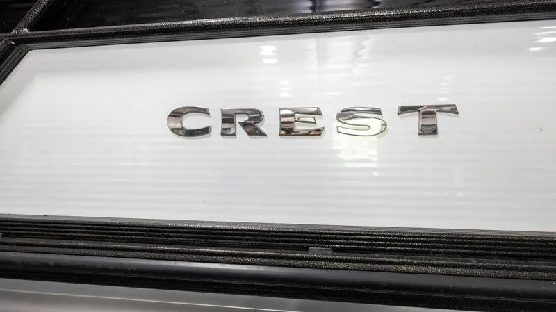 Slide: The Image of 2021 Crest Classic Platinum 220 SLSC boat logo in chrome on white background. - 5