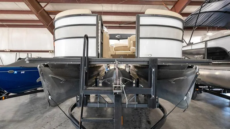 Slide: The Image of 2021 Crest Classic Platinum 220 SLSC pontoon boat in storage facility. - 6