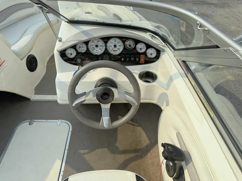 Slide: The Image of 2008 Stingray 195 LX boat dashboard with steering wheel and instrument panel. - 11