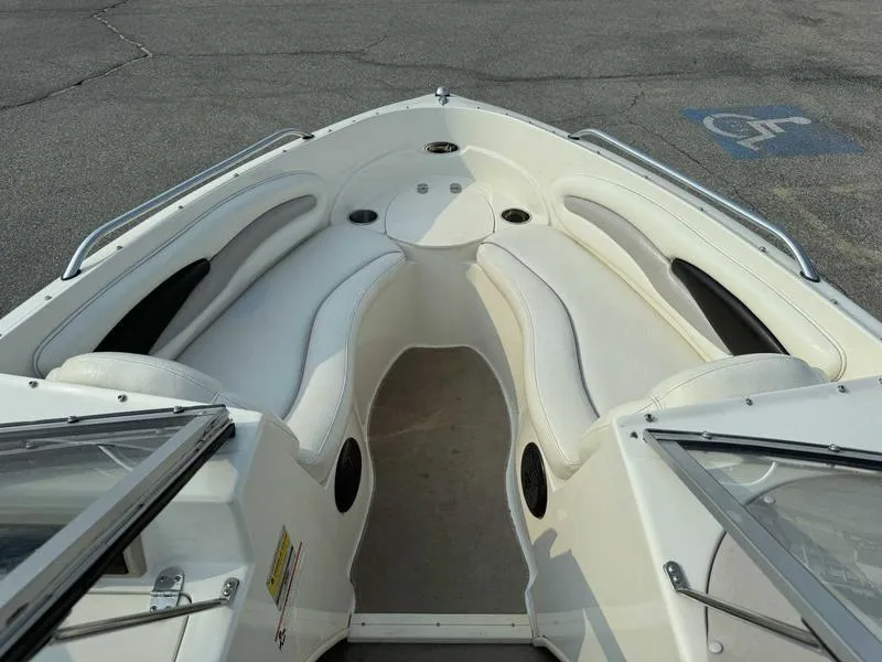 Slide: The Image of 2008 Stingray 195 LX boat interior with white seating and cup holders. - 12