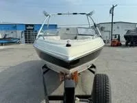 Slide: The Image of 2008 Stingray 195 LX boat on trailer in a marina parking lot. - 16