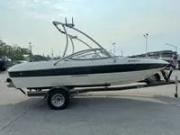 Slide: The Image of 2008 Stingray 195 LX boat on a trailer in a parking lot. - 18