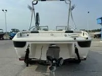 Slide: The Image of 2008 Stingray 195 LX boat rear view with outboard motor. - 19