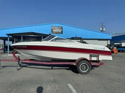 Slide: The Image of 2008 Stingray 195 LX boat on a trailer in front of a blue building. - 28