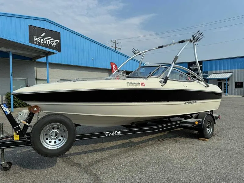 Slide: The Image of 2008 Stingray 195 LX boat on trailer outside Prestige Marine showroom. - 3