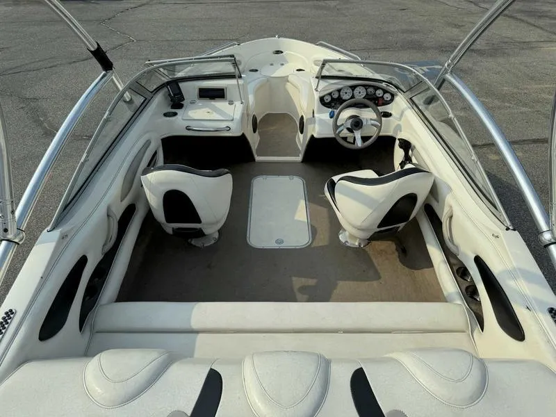 Slide: The Image of 2008 Stingray 195 LX boat interior with seating and steering wheel. - 8