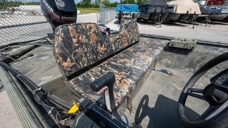 Slide: The Image of 2003 War Eagle 754 LDSV boat with camo seating and Tracker outboard motor. - 12