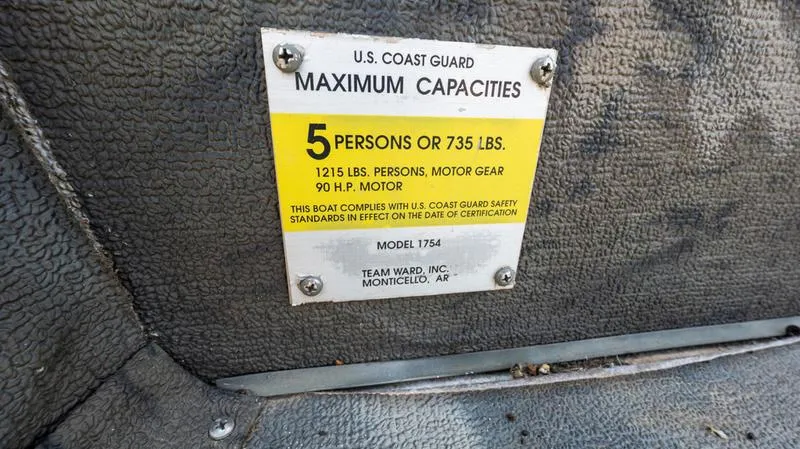 Slide: The Image of 2003 War Eagle 754 LDSV boat capacity label, 5 persons or 735 lbs, 90 HP motor. - 14