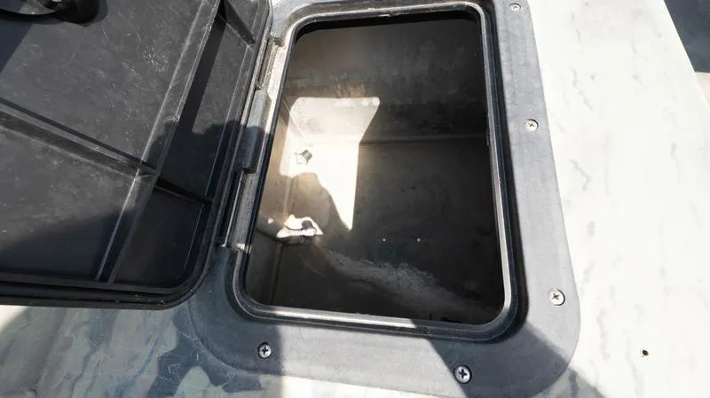 Slide: The Image of Open storage compartment of a 2003 War Eagle 754 LDSV boat. - 19