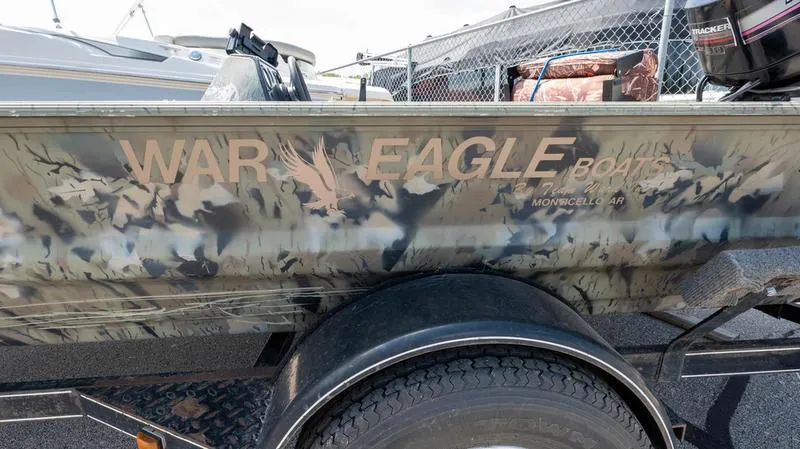 Slide: The Image of 2003 War Eagle 754 LDSV boat with camouflage design on trailer. - 2