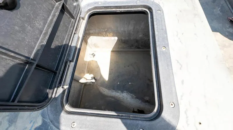Slide: The Image of Open storage compartment of a 2003 War Eagle 754 LDSV boat. - 20