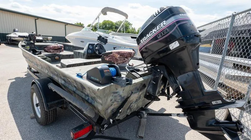 Slide: The Image of 2003 War Eagle 754 LDSV boat with Tracker outboard motor on trailer. - 23
