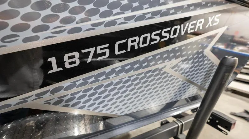 Slide: The Image of 2024 Lund 1875 Crossover XS boat with modern design and graphics. - 6