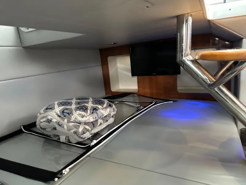 Slide: The Image of Interior cabin of a 2015 Formula 350 CBR boat with TV and bedding. - 17