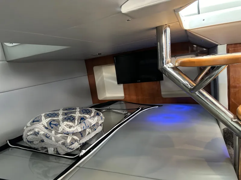 Slide: The Image of Interior cabin of a 2015 Formula 350 CBR boat with bedding and TV. - 18