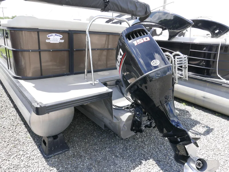Slide: The Image of 2019 Manitou 23 Aroura VP pontoon boat with 150 HP outboard motor. - 2