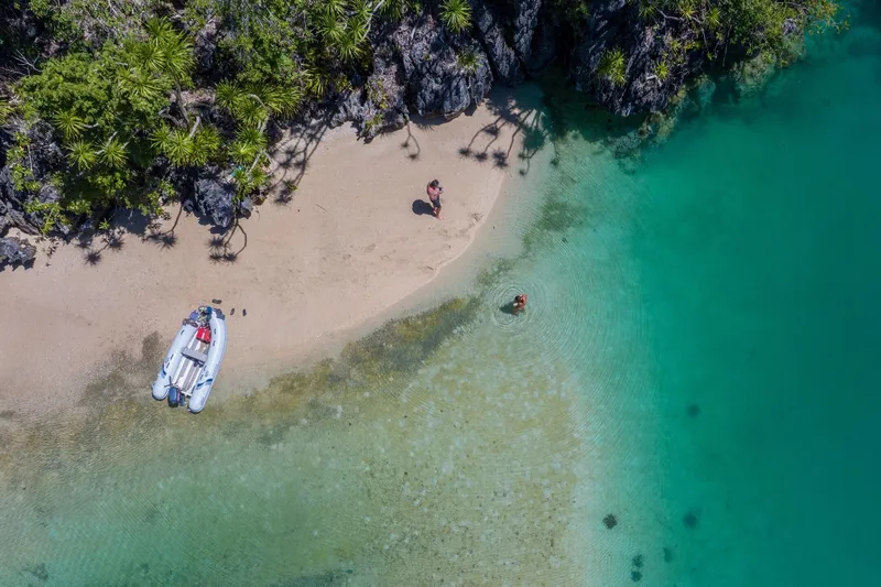 Slide: The Image of Aerial view of beach with Highfield Ultralite 240LT boat, 2026 model. - 11