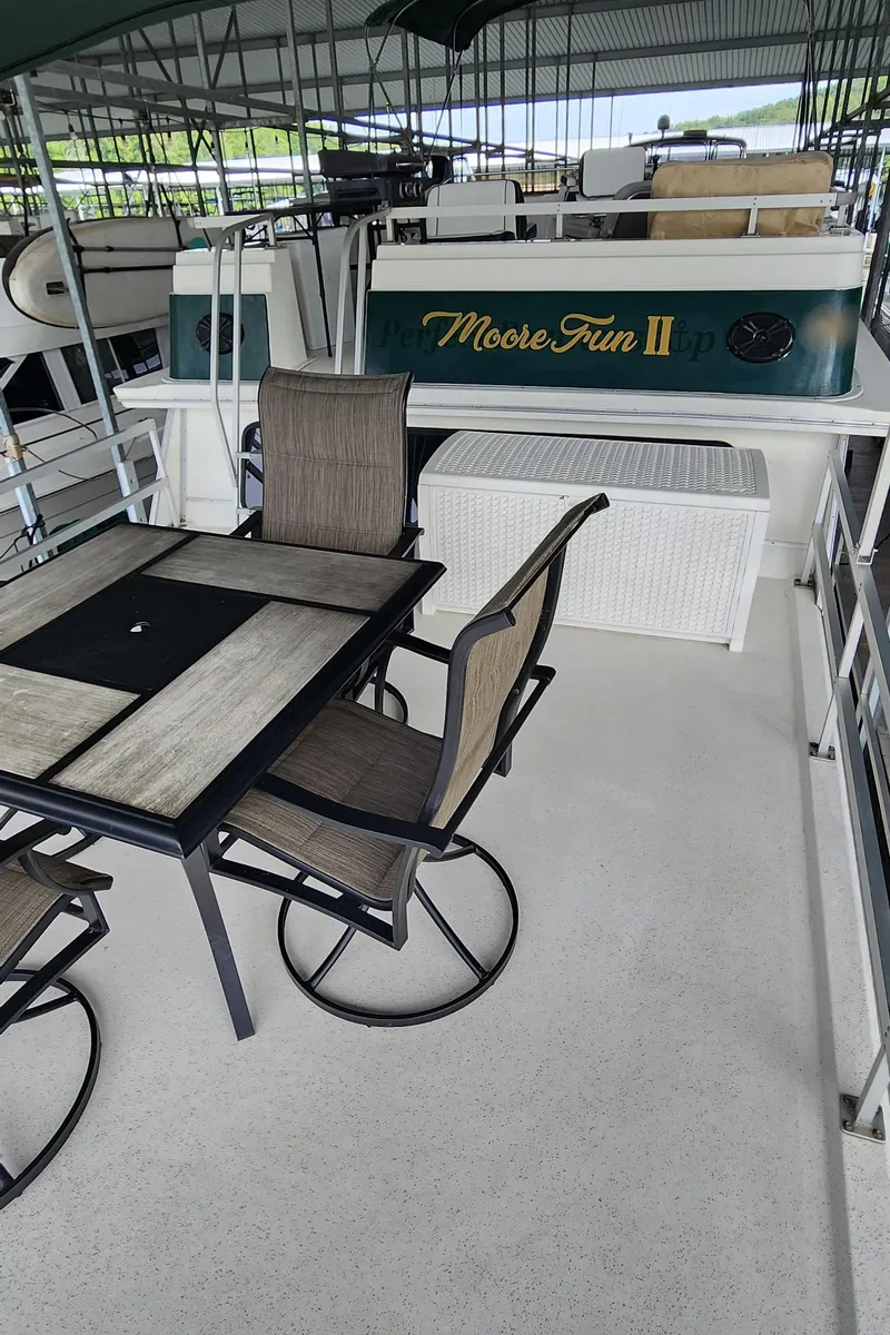 Slide: The Image of Outdoor seating area on a 1993 Gibson 50 Cabin Yacht named Moose Fun II. - 26