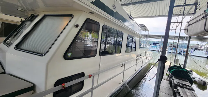 Slide: The Image of 1993 Gibson 50 Cabin Yacht docked at marina. - 3