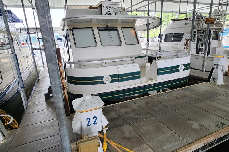 Slide: The Image of 1993 Gibson 50 Cabin Yacht docked at marina, slip number 22. - 33