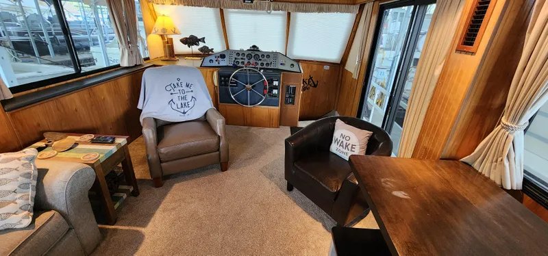 Slide: The Image of Interior of a 1993 Gibson 50 Cabin Yacht with cozy seating and helm station. - 43