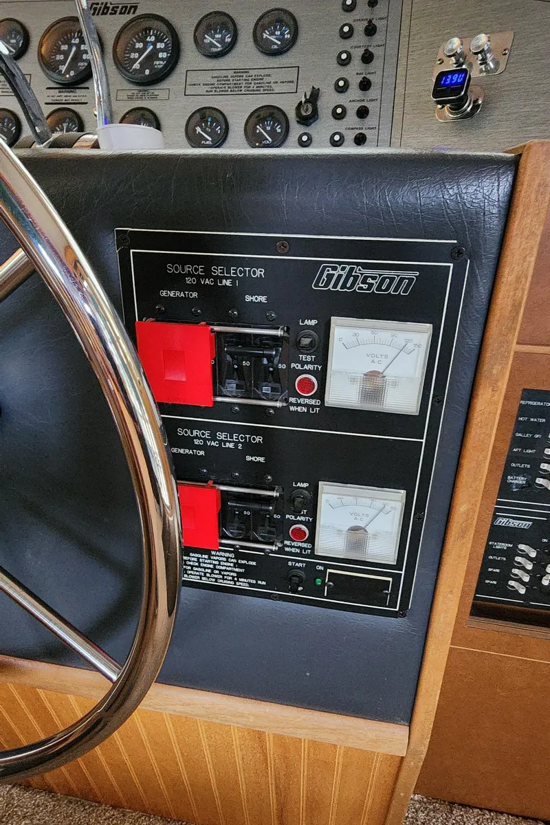 Slide: The Image of Control panel of a 1993 Gibson 50 Cabin Yacht with source selectors and gauges. - 47