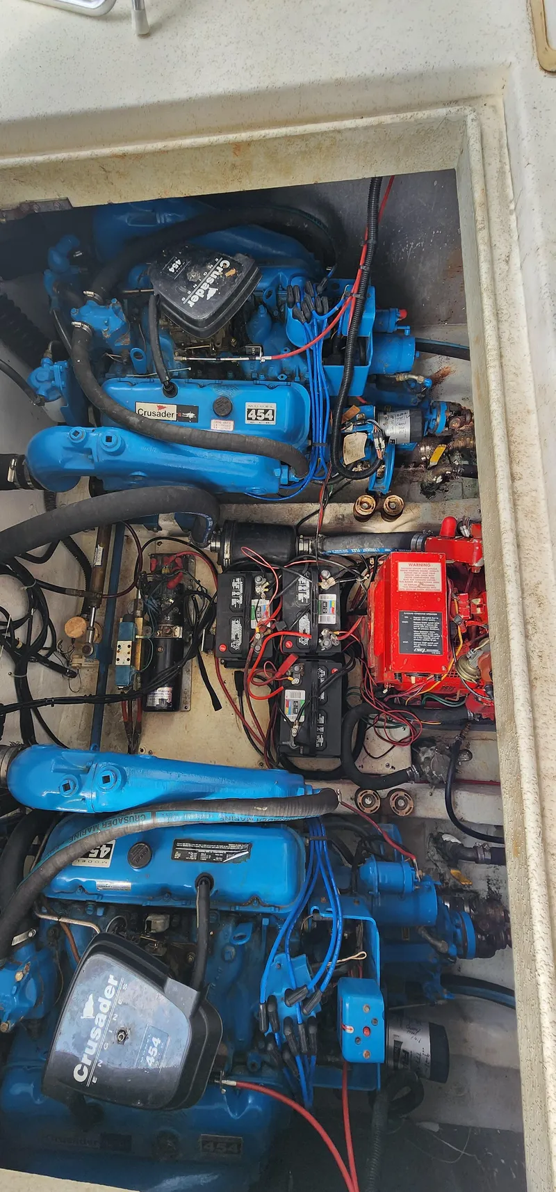 Slide: The Image of Engine compartment of a 1993 Gibson 50 Cabin Yacht with twin blue engines. - 7