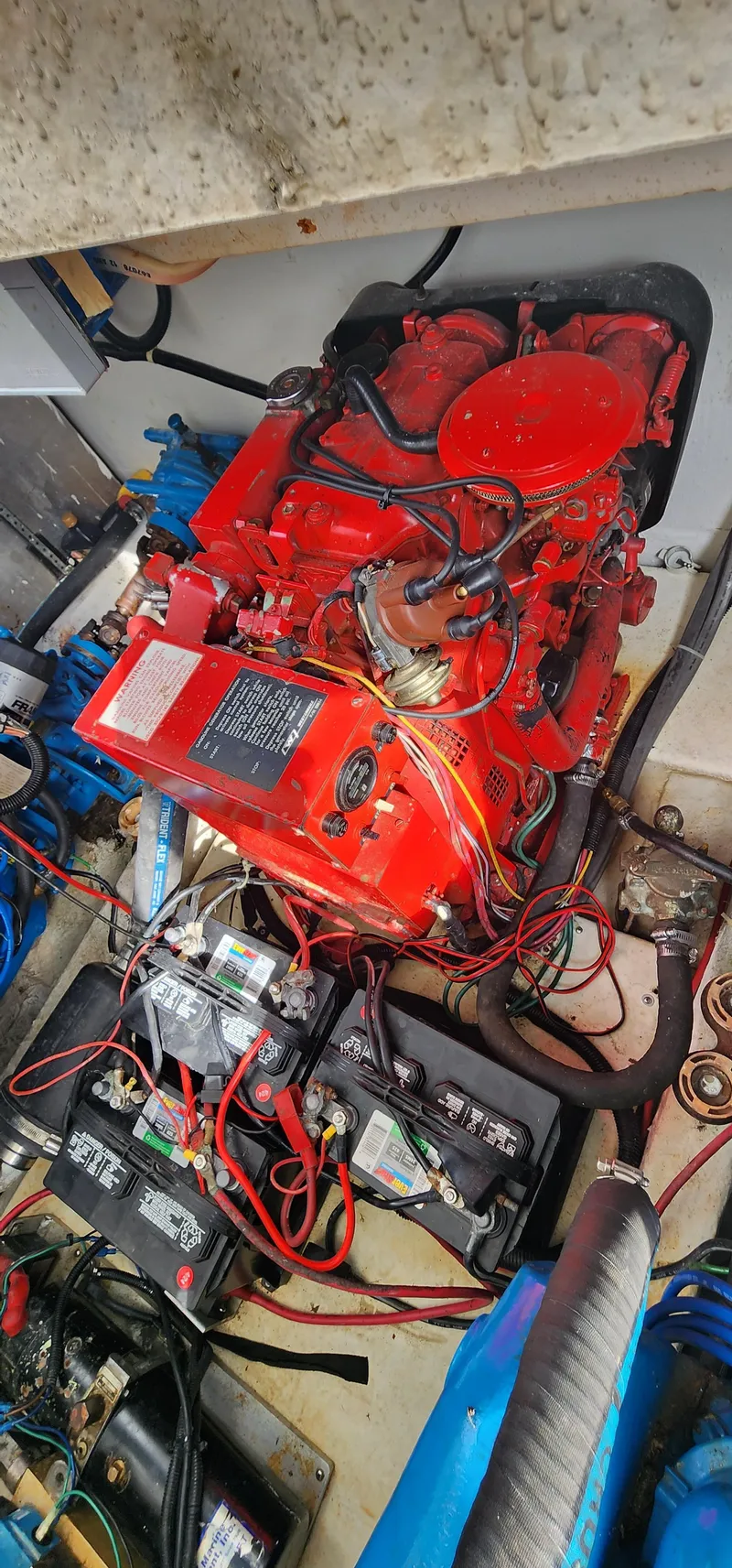 Slide: The Image of Engine compartment of a 1993 Gibson 50 Cabin Yacht with red engine and wiring. - 8