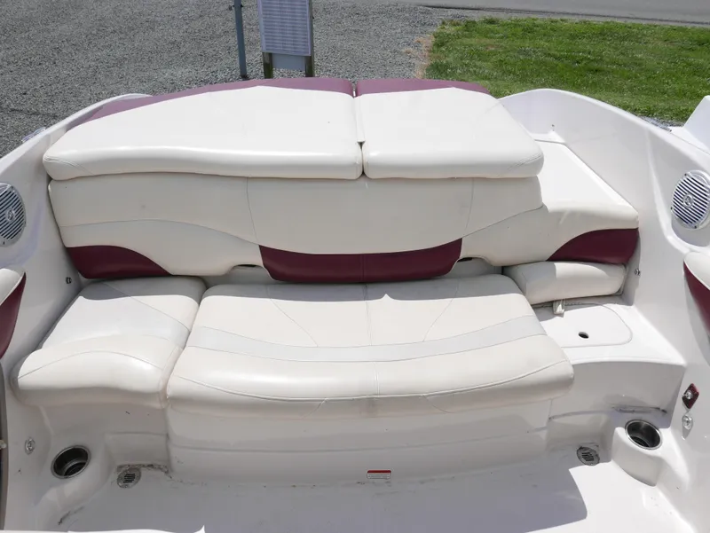 Slide: The Image of 2011 Tahoe Q7SSF1 boat interior seating with white and maroon upholstery. - 10