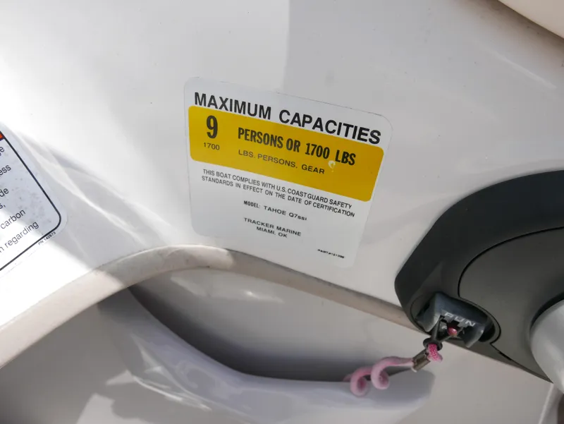 Slide: The Image of Maximum capacity label on 2011 Tahoe Q7SSF1 boat, 9 persons or 1700 lbs. - 13