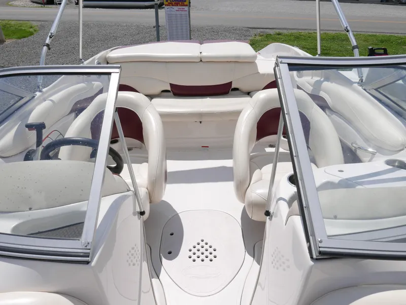 Slide: The Image of 2011 Tahoe Q7SSF1 boat interior with white and maroon seating. - 7