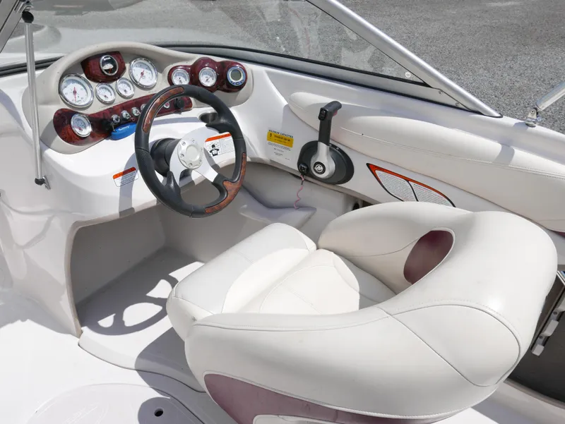 Slide: The Image of 2011 Tahoe Q7SSF1 boat cockpit with steering wheel and control panel. - 8