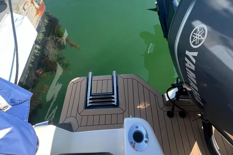 Slide: The Image of 2019 Scout 235 XSF boat with Yamaha engine and swim platform. - 23