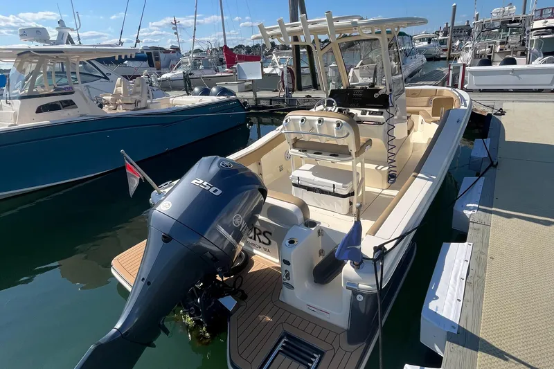 Slide: The Image of 2019 Scout 235 XSF boat docked at marina with Yamaha 250 outboard motor. - 3