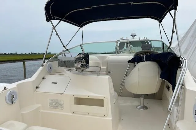 Slide: The Image of 2001 Rinker 270 Fiesta Vee boat interior with canopy and seating. - 4