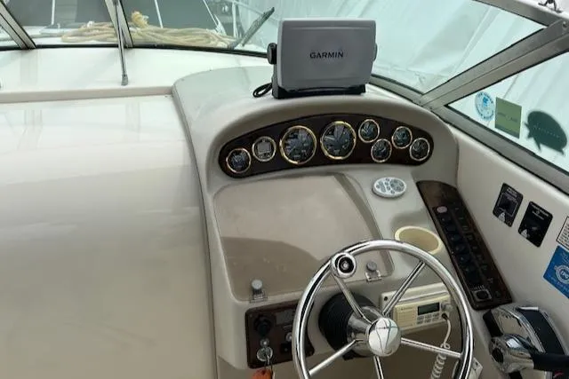 Slide: The Image of 2001 Rinker 270 FIESTA VEE boat dashboard with Garmin GPS and steering wheel. - 5