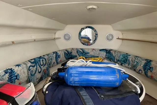 Slide: The Image of 2001 Rinker 270FIESTAVEE boat cabin with nautical decor and equipment. - 6