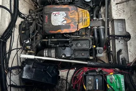 Slide: The Image of Engine compartment of a 2001 Rinker 270 FIESTA VEE boat, showcasing mechanical components. - 9